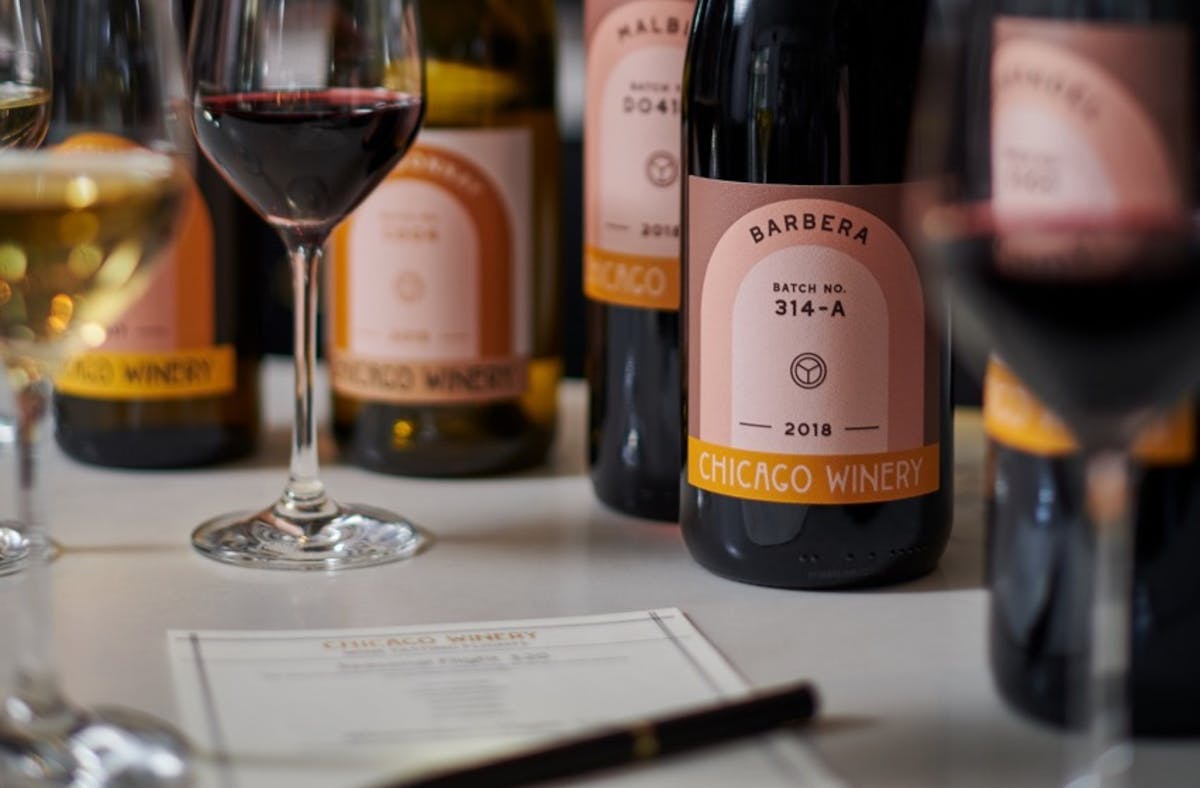 a close up of a bottle and a glass of wine